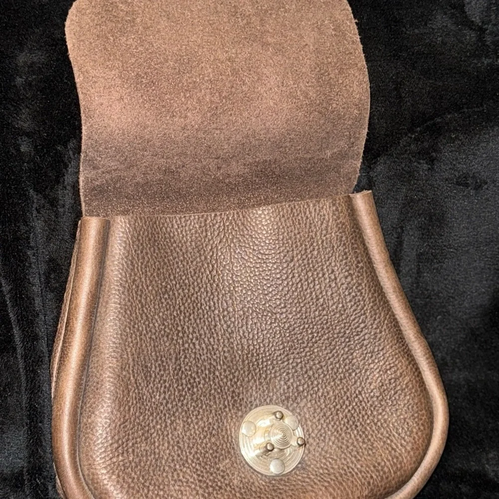 Brown Leather Backpack with Classic Design and Flap Closure